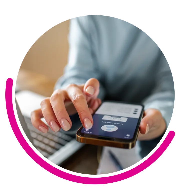 Checking call activity on a phone beside a laptop